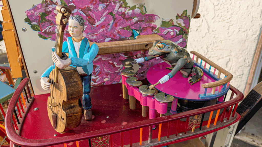 a double bass player and a toad xylophone player automatons